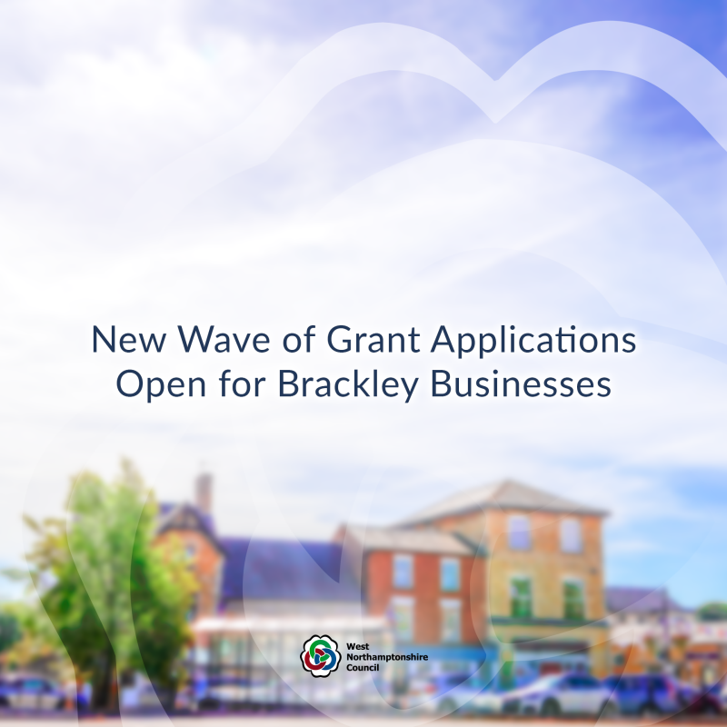 Blurred background that shows a Brackley High Street with title that reads 'New Wave of Grant Applications Open for Brackley Businesses'.